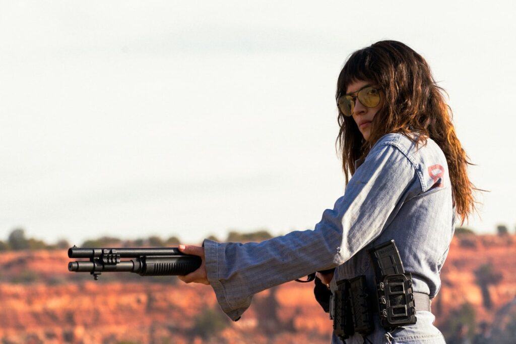Adria Arjona Leads Chainsaw-Wielding Sniper in Onslaught Images Ahead of September 2026 Release